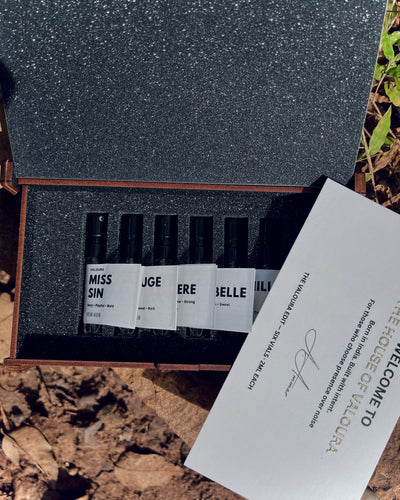 Discovery set for Her placed on wooden surface with leaves background