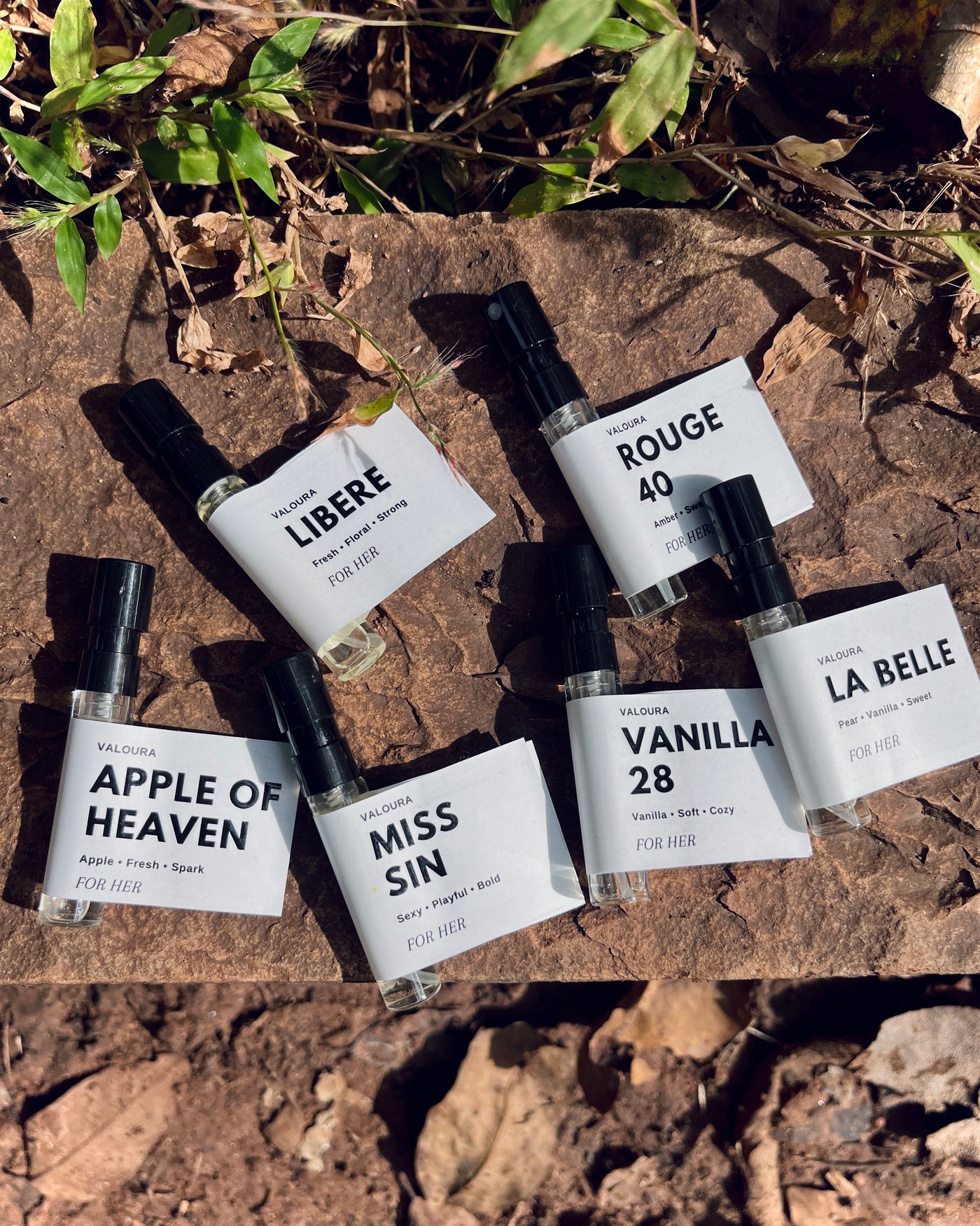 Close-up of Valoura Edit For Her vials with labels visible in natural light