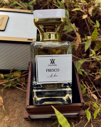 Perfume bottle labeled 'Fresco' on Valoura packaging box   by Valoura  on a natural background