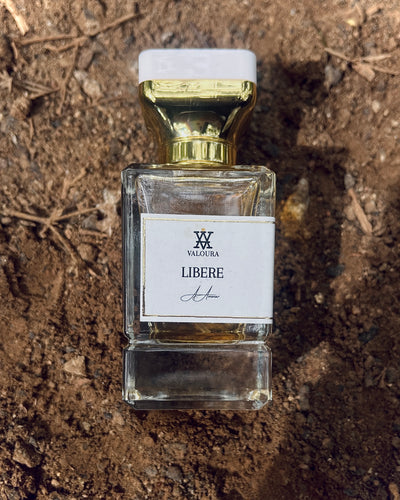 Perfume bottle labeled 'Libere' by Valoura on a textured brown background