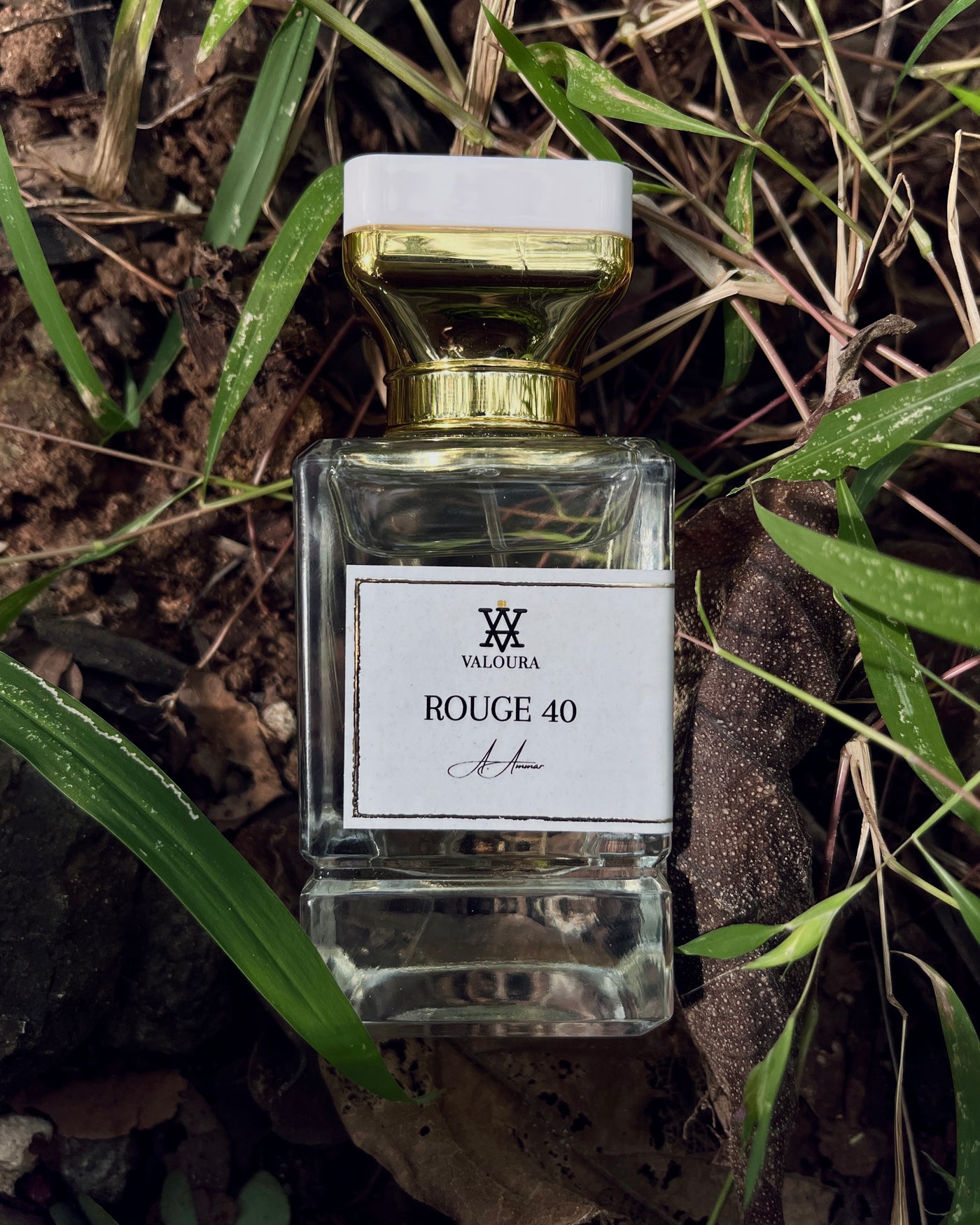 Perfume bottle labeled 'Rouge 40' by Valoura on a natural background